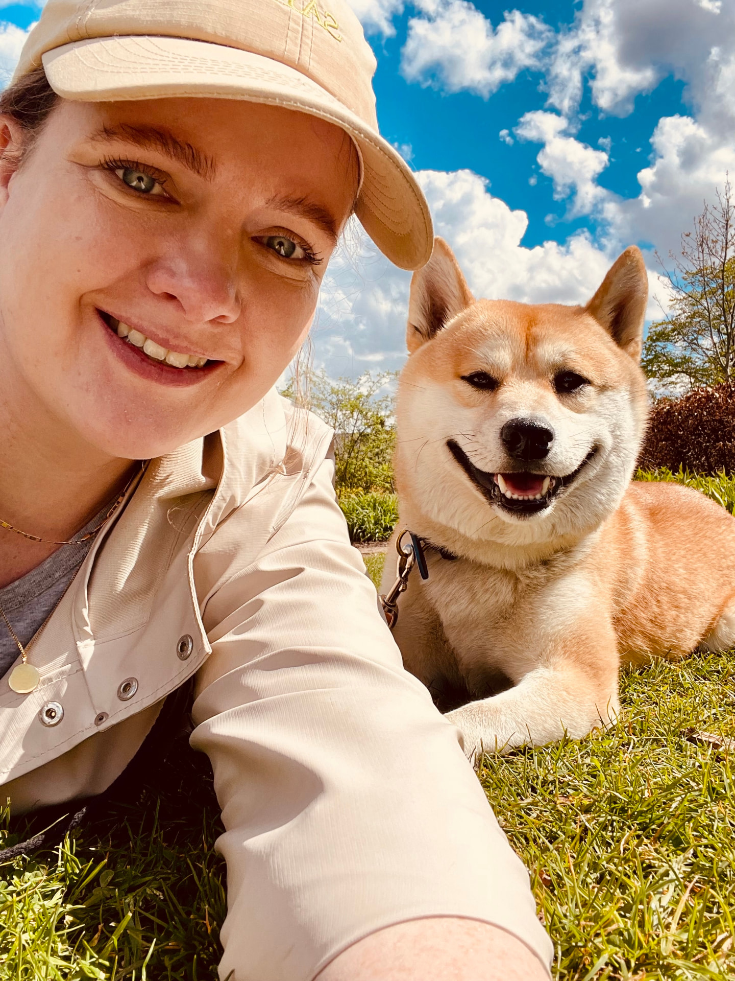 Lorna Mullins, founder of Fetch Travels, with a happy dog on a sunny day
